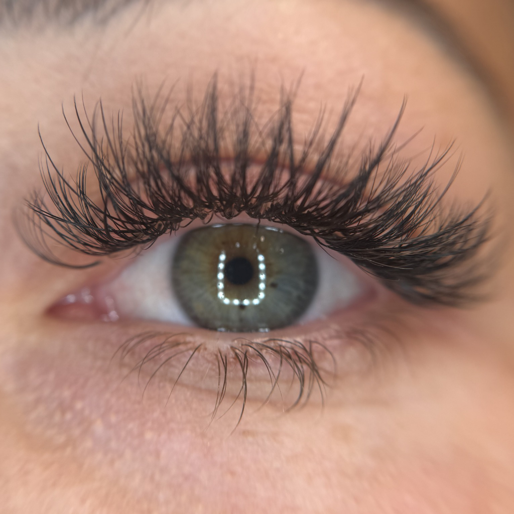Light volume lash extensions on a client at ELY-G Lashes & Spa in Bedford, NH